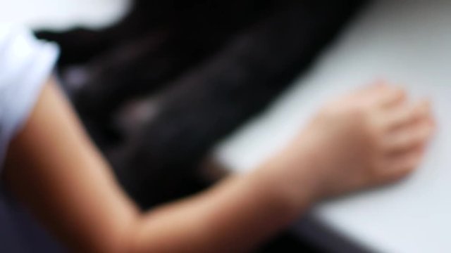 Little child girl face portrait grimace show tongue to camera