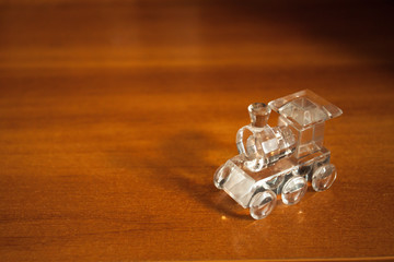 Glass locomotive on wood