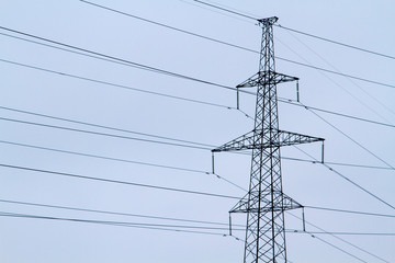 Towers of high voltage transmission lines in the winter