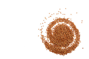 Grains of buckwheat on white background.