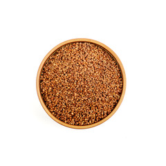 Buckwheat in a ceramic bowl isolated on white background.