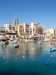 Spinola Bay, St Julians's Malta with Portomaso tower in the background