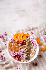 delicious and healthy Breakfast smoothie bowl with peach and Chia seeds