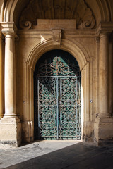 Naklejka premium Ornate metal and wood door to the grandmaster's palace courtyard in Valletta, Malta