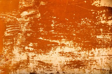 Colorful orange texture of old paint on rusty metal door