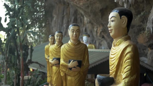 Monk statue cave Myanmar