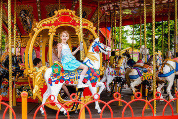 Blonde girl and ginger boy in the enterteiment park. RUSSIA, SOCHI, Sochi-park, june 2018