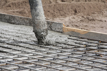 The organization of concrete work. Pouring concrete at a construction site. Construction of a new...