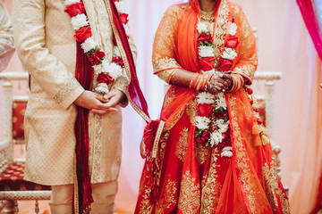 Ritual with coconut leaves during traditional Hindu wedding ceremony