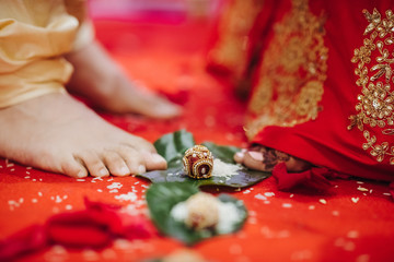 Ritual with coconut leaves during traditional Hindu wedding ceremony