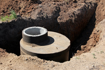 Works on laying of the sewerage on a building site. New facility with new sewers.