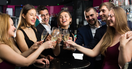 Office workers are drinking sparkling wine