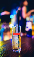 Cocktail drink Glass on the table. Night life or night club background concept image.