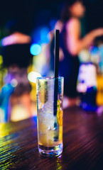 Cocktail drink Glass on the table. Night life or night club background concept image.