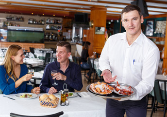 Fototapeta na wymiar Waiter with tray of crustaceans