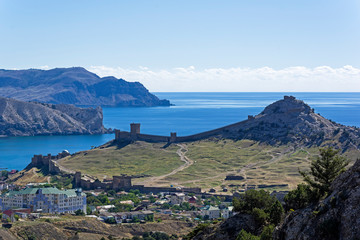 Panorama of the medieval Genoese fortress from the slope of a nearby mountain.