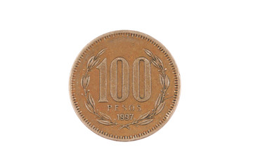 A macro image of an old Chilean one hundred peso coin isolated on a white background