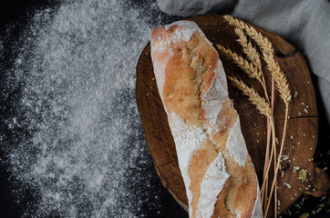 Freshly baked homemade traditional bread on rustic wooden table