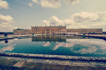 Fototapeta premium View of the Palace of Versailles in the Reflecting pool in the gardens