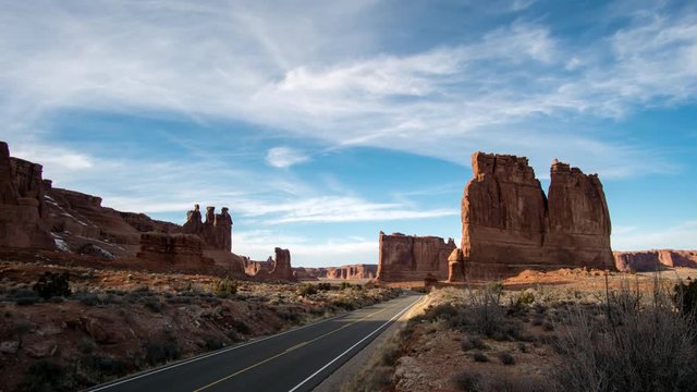 Time lapse in Arches National Park viewing the desert landscape of the Three Sisters, Tower of Babel, and The Organ.