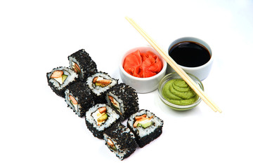 California roll black with soy sauce, wasabi, ginger and chopsticks on white background. Japanese food