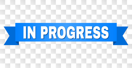 IN PROGRESS text on a ribbon. Designed with white title and blue stripe. Vector banner with IN PROGRESS tag on a transparent background.