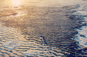 frozen over black sand beach in Iceland 