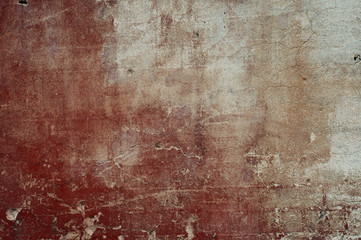 Background. Antique surface with cracks, potholes and stains of red paint. Daylight shooting