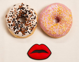 donuts like eyes with lips on a white background