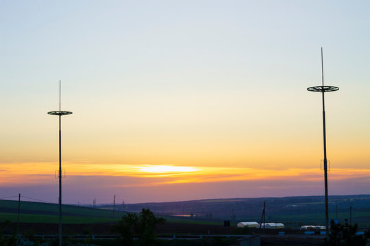 The silhouettes of lightning rods at sunset, protecting the city from lightning strikes