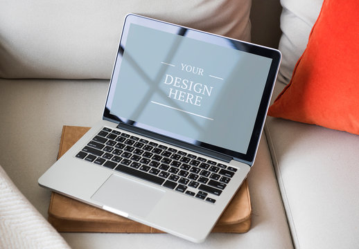 Laptop on Light-Colored Couch Mockup
