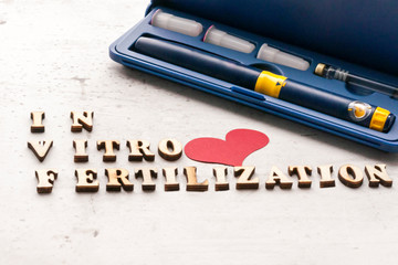 In Vitro Fertilization Injection Pen. Syringe with a thin ogre. Concept IVF Treatment Drugs...