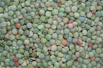 Lentils the dry product as a backdrop for the design.