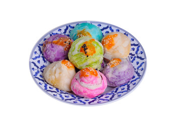  Colorful Chinese pastry moon cake on Thai style plate .