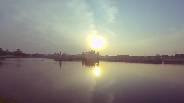 Lake with beautiful skies and a beautiful palace sunset Time lapse Video  I  Jamnagar City Lakhota lake Gujarat Sun set time lapse