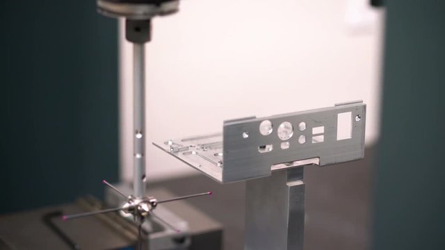 Quality control, CMM measuring device in a manufacturing plant.