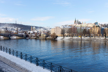 Snowy Prague Lesser Town with Prague Castle above River Vltava, Czech republic