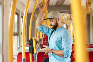 Young man in city transport