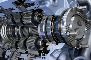 Gearbox cross-section, engine industry, sprockets, cogwheels and bearings of automotive transmission for oversize trucks, SUV, cargo, commercial and construction vehicles, selective focus - 247669225