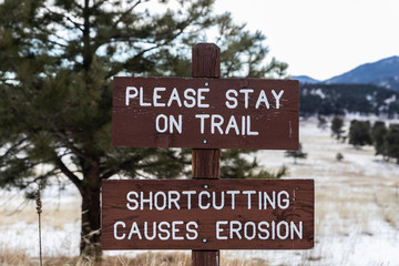 Please stay on trail sign