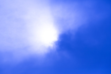 deep blue sky view with sun behind the cloud - 247671245