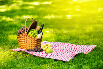 Picnic basket in summer park