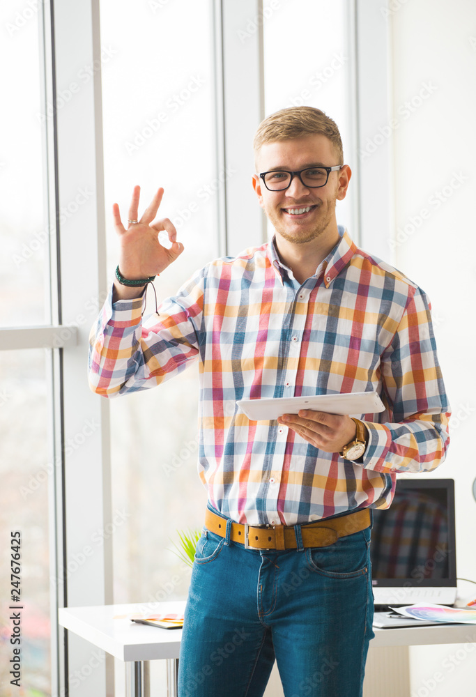 Poster web designer working on the best framework of a new application