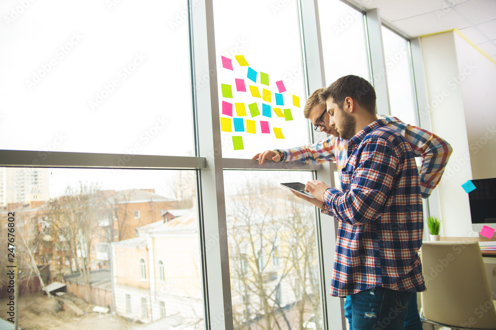 Poster web designer working on the best framework of a new application