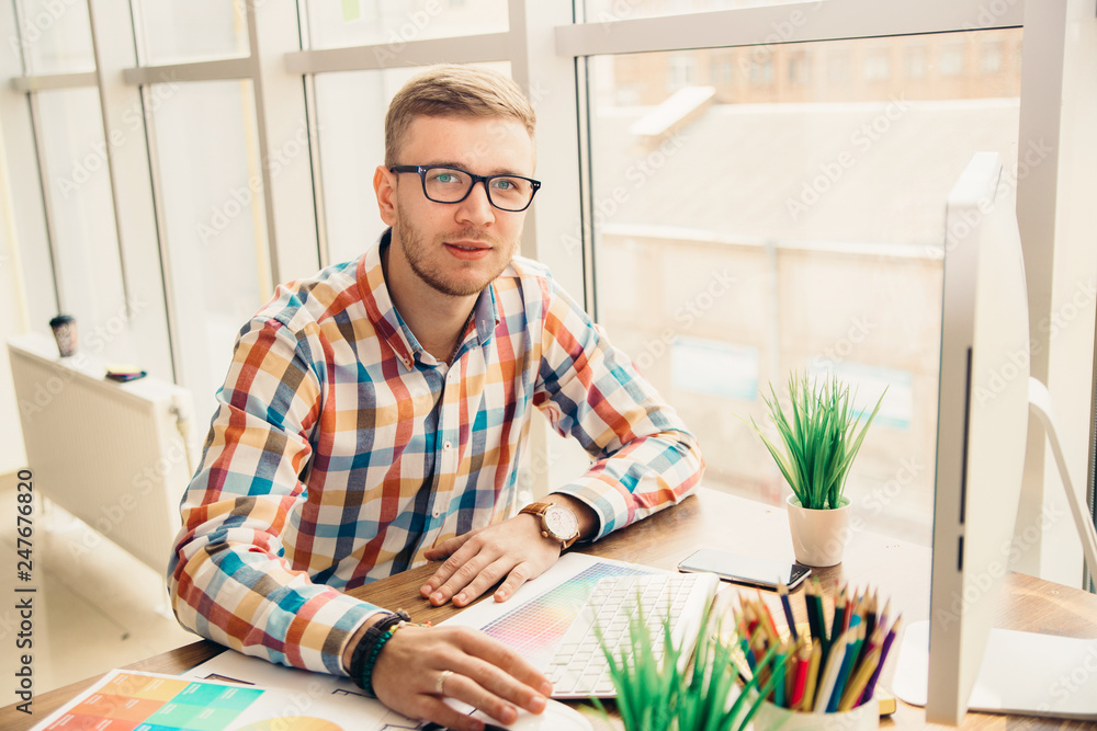 Poster web designer working on the best framework of a new application