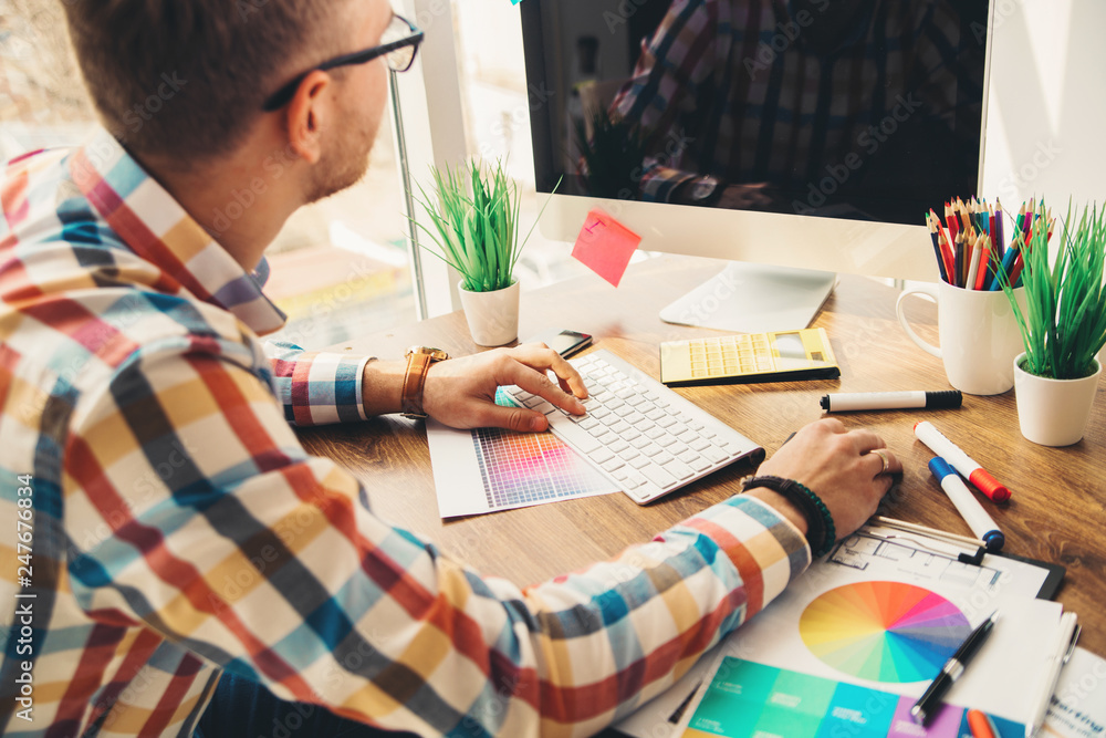 Poster web designer working on the best framework of a new application