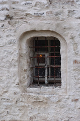 Fototapeta na wymiar Small window of ancient church