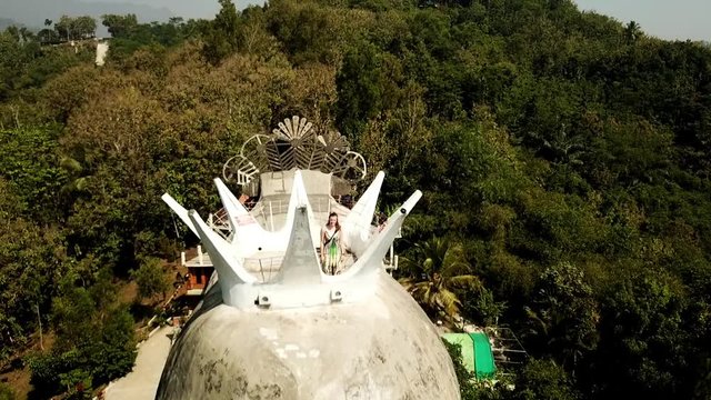 Drone view of the chicken church, Gereja Ajam in Java, Indonesia with a model in the crown.