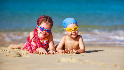 children boy and girl in swimsuit   on beach  .
