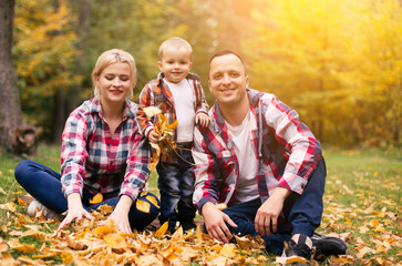 Family on weekend. Mother father and son in park